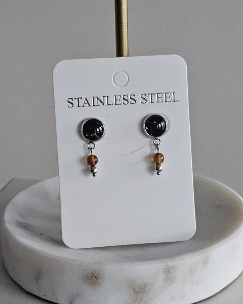 Product image of Pieni musta Art nappi koristeella