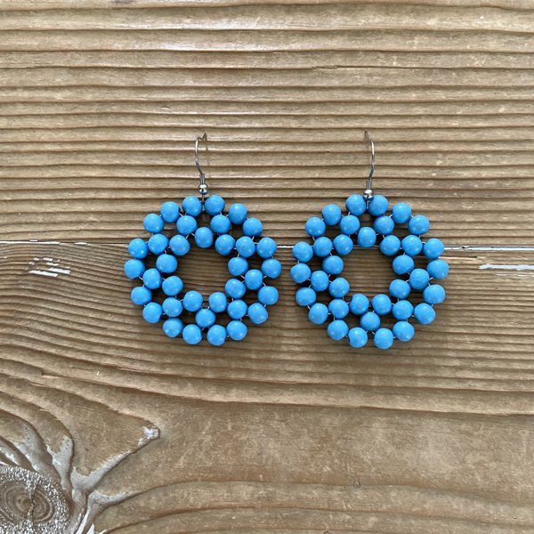 Product image of  Kehrä-korvakorut vaalea sininen